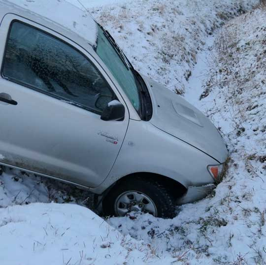 Car down a snow covered embankment in Clinton Maryland