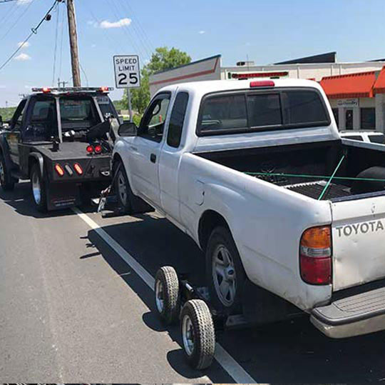 Intense Towing with a wrecker providing towing service for a pickup truck in Clinton Maryland